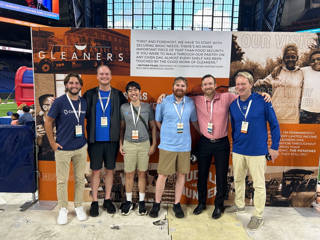 The Counterpart team at Gleaners' Huddle Against Hunger on the field at Lucas Oil Stadium