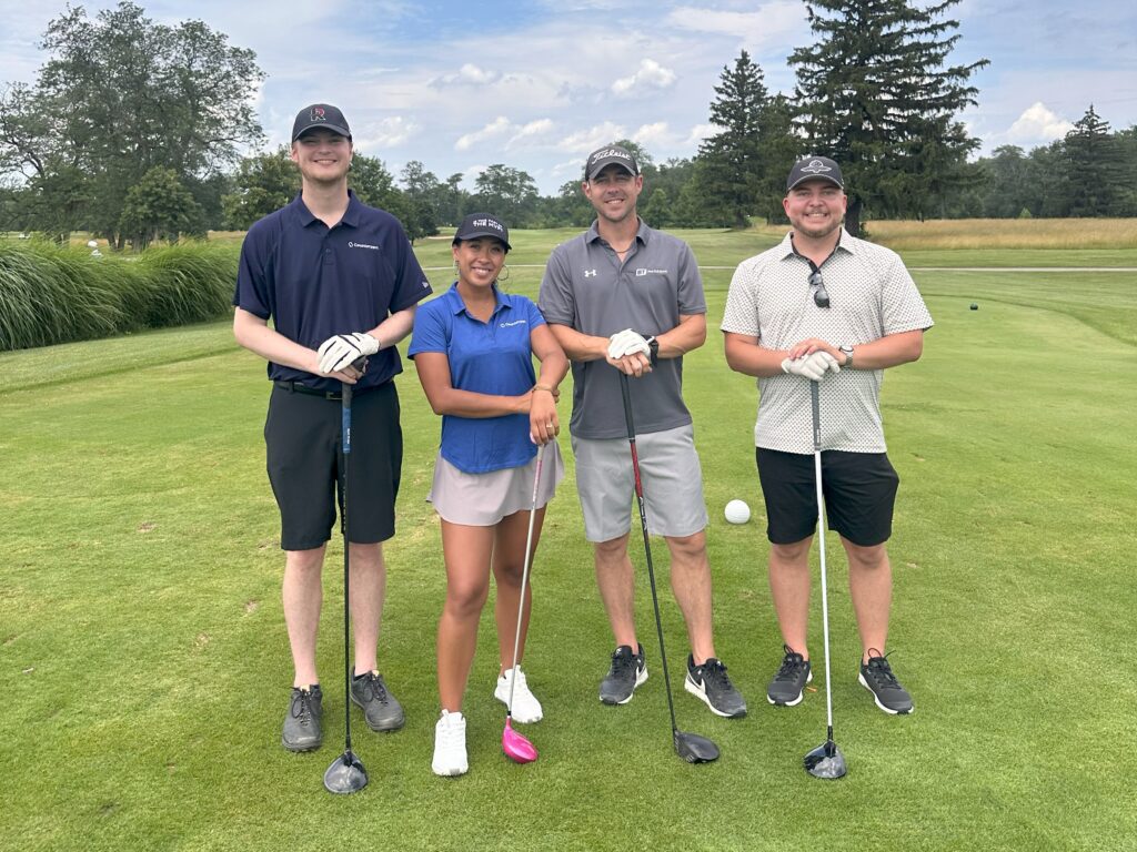 Steve, Arianna, Nick, and Luke on the golf course