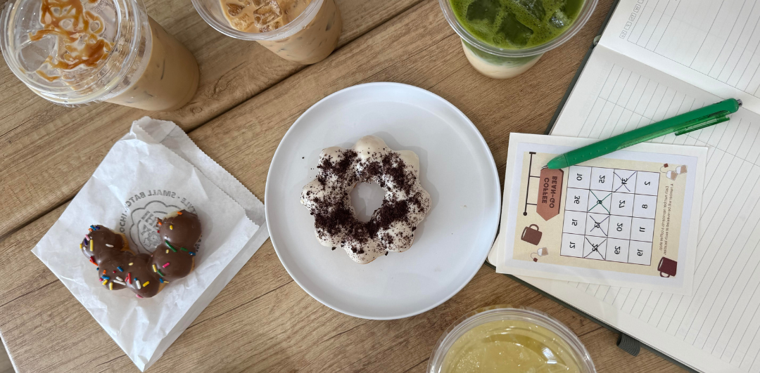 Overhead view of Mochi Joy drinks and donuts.